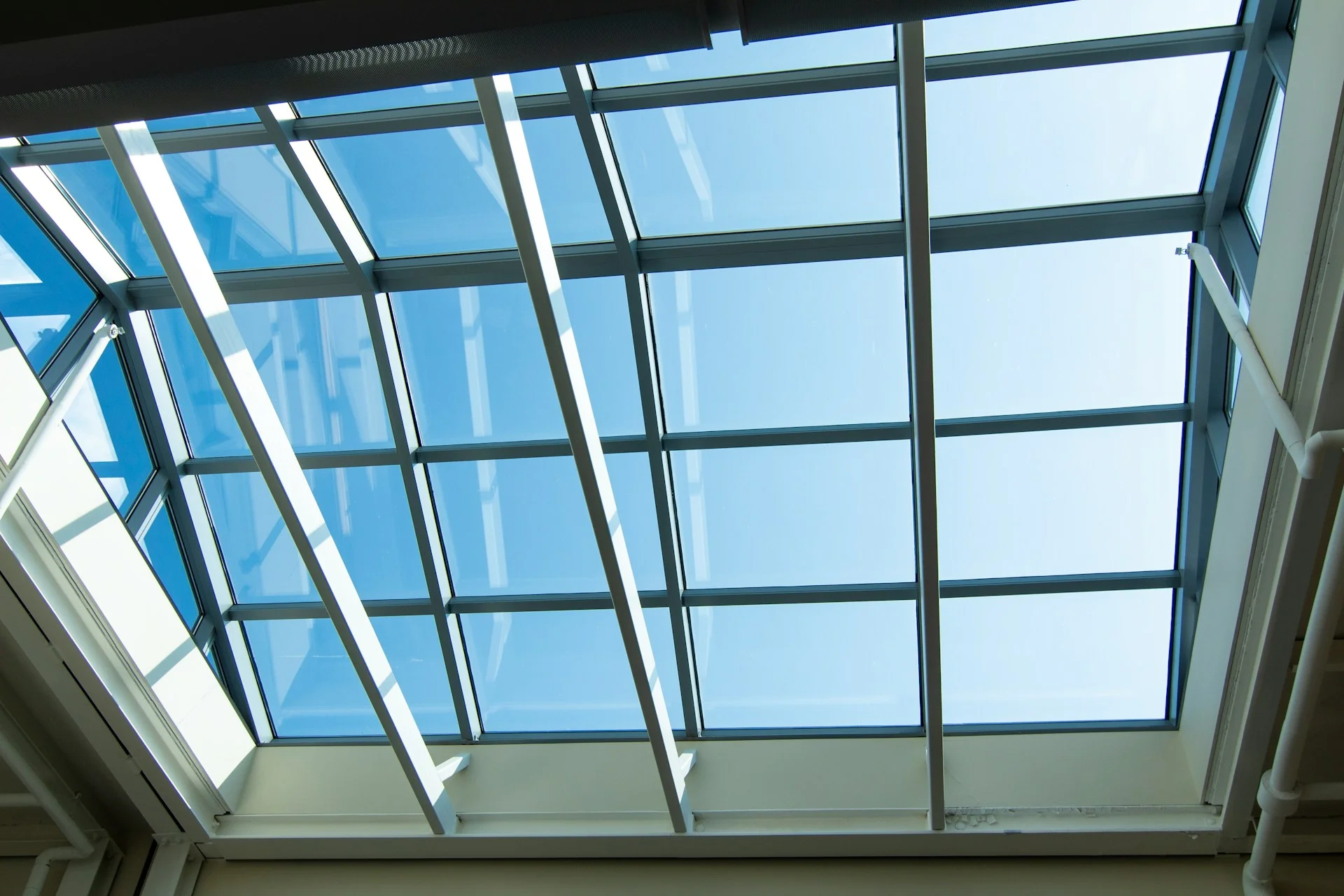 Architectural skylight system spanning a residential ceiling, showing the scale and angle of typical American skylight installations